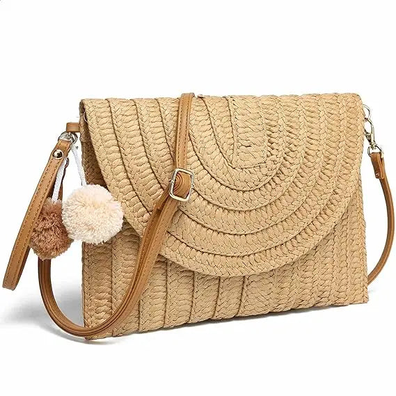 A stylish straw woven raffia envelope clutch bag with intricate weaving, perfect for bohemian fashion lovers.