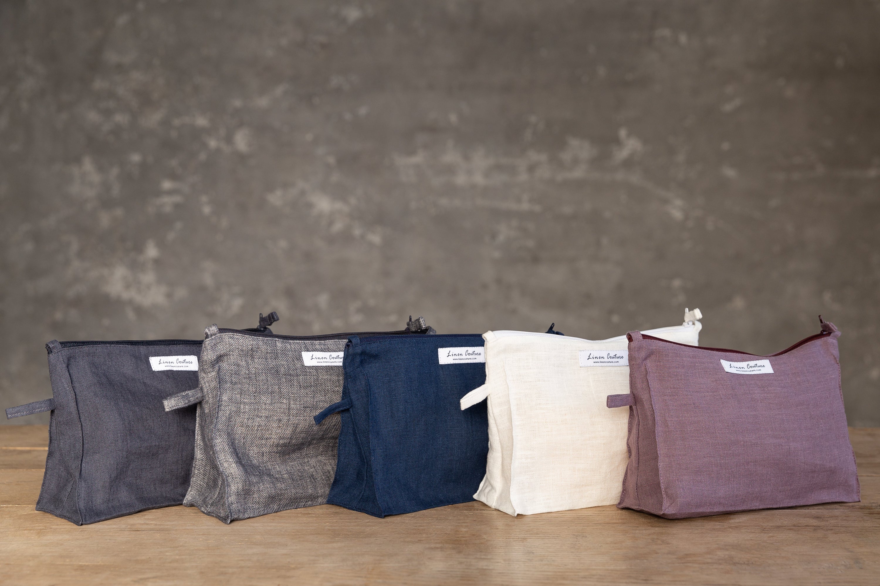 Large double cloth linen makeup bag in Grey and Natural with zipper closure, showcasing its elegant design and spacious interior.