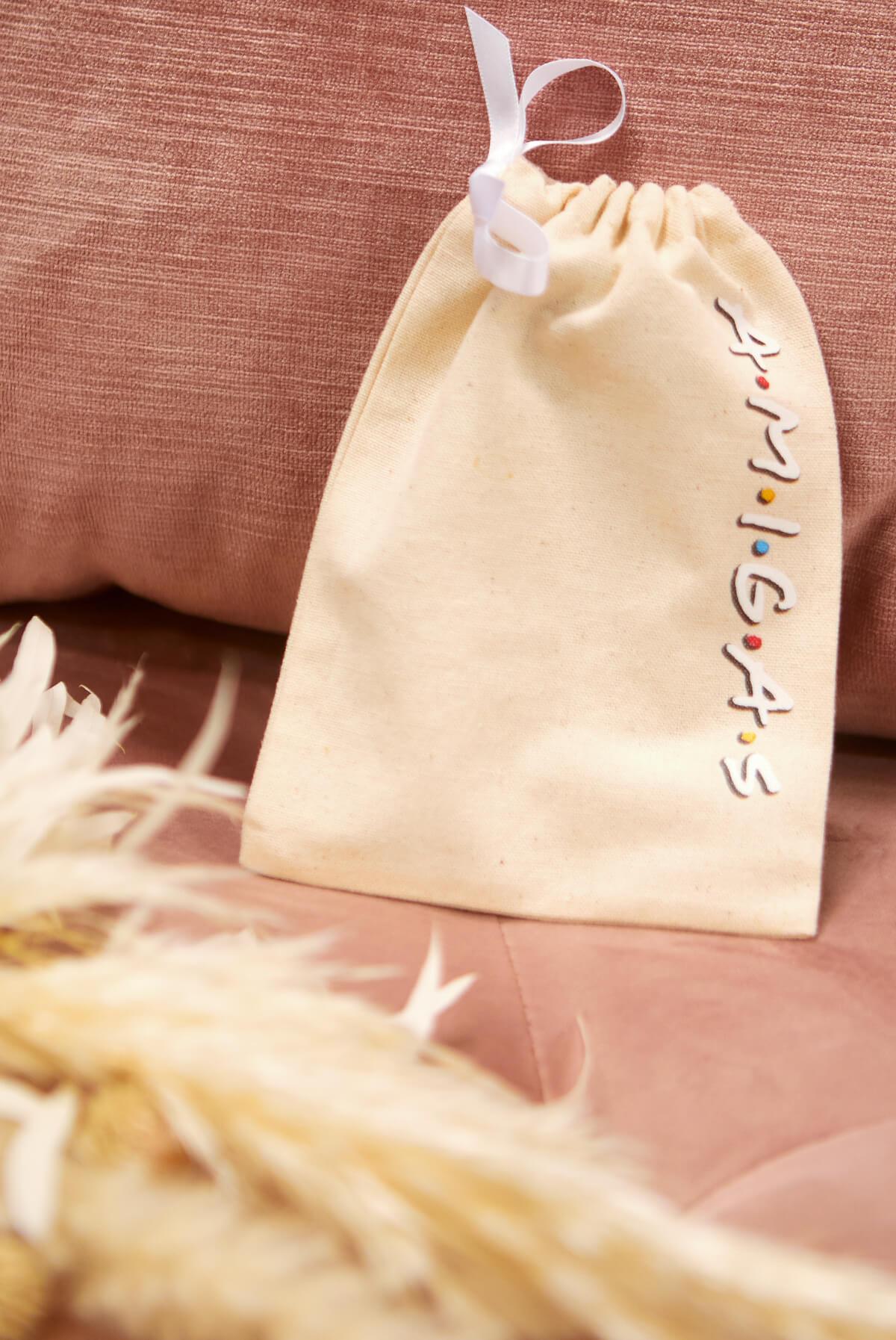 FRIENDS Bride Amigas Hangover Kit Bags in canvas, featuring B.R.I.D.E and A.M.I.G.A.S embellishments, perfect for party favors.