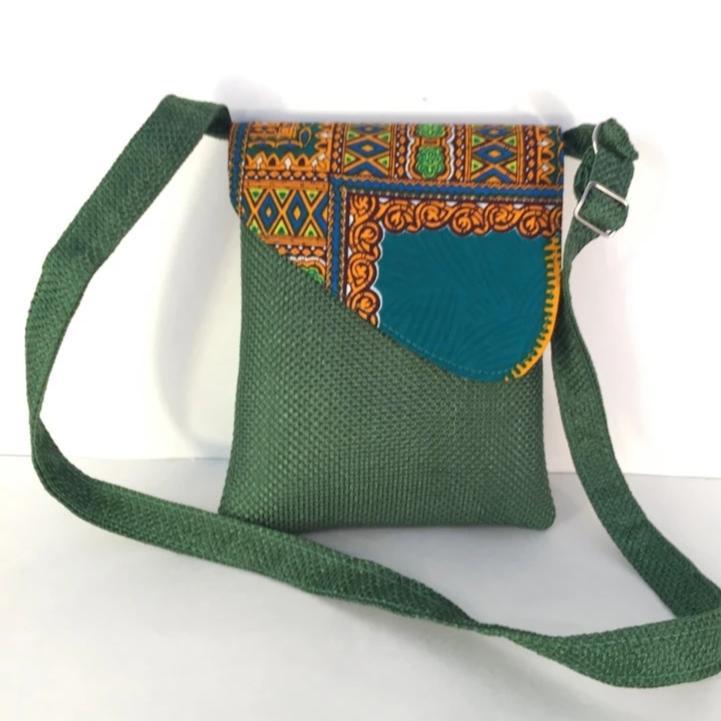 A vibrant African traditional CrossBody Handmade Laptop Bag featuring colorful Kitengi fabric flap and durable hessian woven body, adjustable strap.