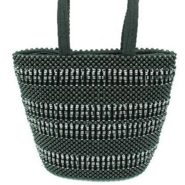 A beautifully crafted Beaded Handmade Shoulder Bag featuring intricate black and silver beads, designed in Uganda, with a padded black background and zippered pocket.