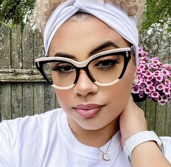 A pair of stylish CatEye Designer Frames in a chic design, perfect for fashion and prescription lenses, displayed with a free leather case.