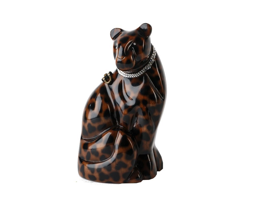 Charlie Cheetah handbag featuring an elegant cheetah design, Swarovski crystal collar, and tortoise shell finish, handmade from carved Acacia wood.