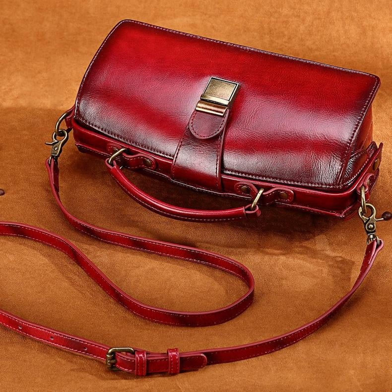 A stylish Classy Leather Doctor Bag made from genuine leather, featuring vintage hardware and a detachable strap for versatile wear.