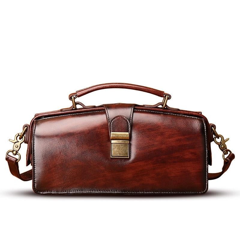A stylish Classy Leather Doctor Bag made from genuine leather, featuring vintage hardware and a detachable strap for versatile wear.