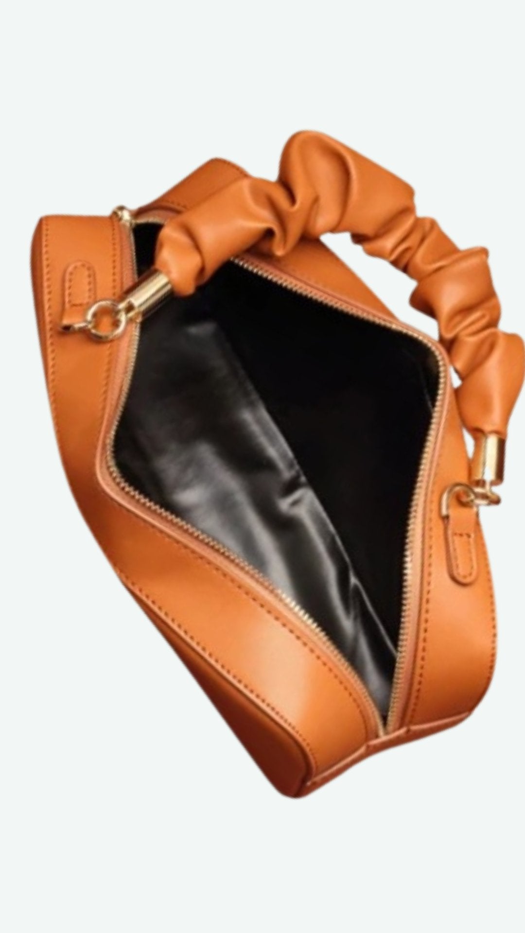 Cube Leather Handbag in soft leather with a sleek design, featuring a comfortable handle and crossbody strap.