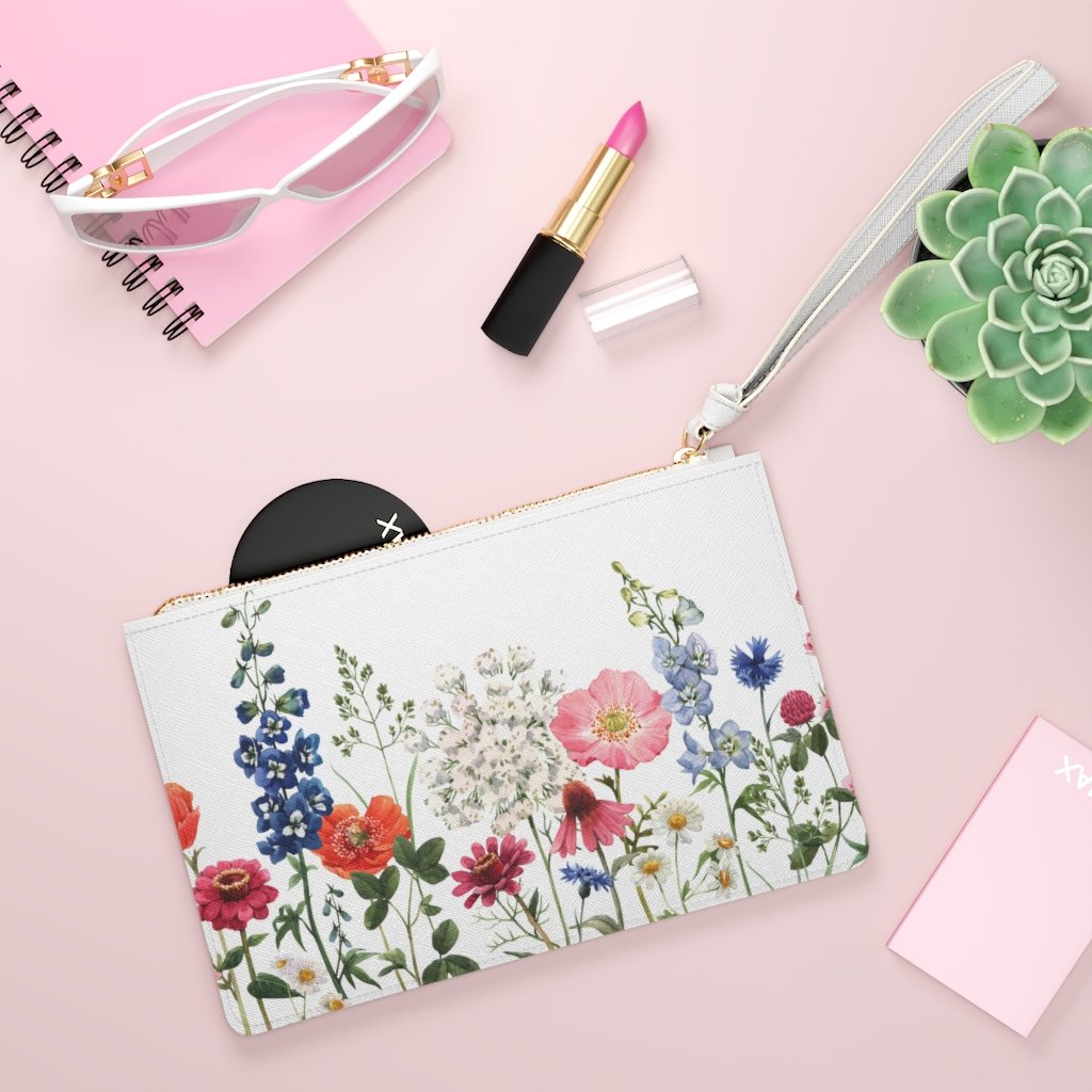 Floral Designed Zipped Clutch Bag made of vegan leather with a loop handle and zip fastening, featuring a beautiful floral pattern.