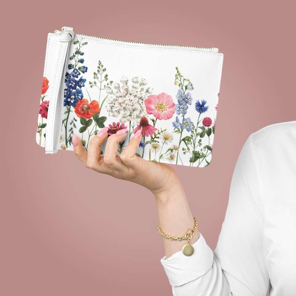 Floral Designed Zipped Clutch Bag made of vegan leather with a loop handle and zip fastening, featuring a beautiful floral pattern.