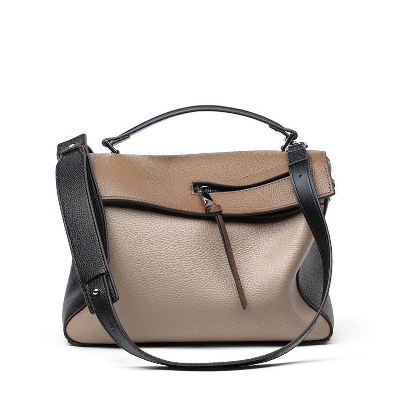 A stylish genuine leather shoulder bag for women, featuring a color contrast design and soft handle, perfect for everyday use.