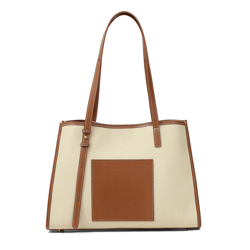 A stylish genuine leather shoulder bag in a large-capacity design, featuring a zipper and lock closure, perfect for everyday use.