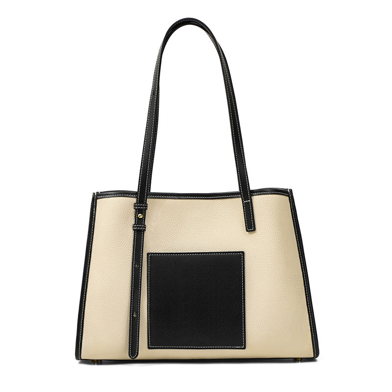 A stylish genuine leather shoulder bag in a large-capacity design, featuring a zipper and lock closure, perfect for everyday use.