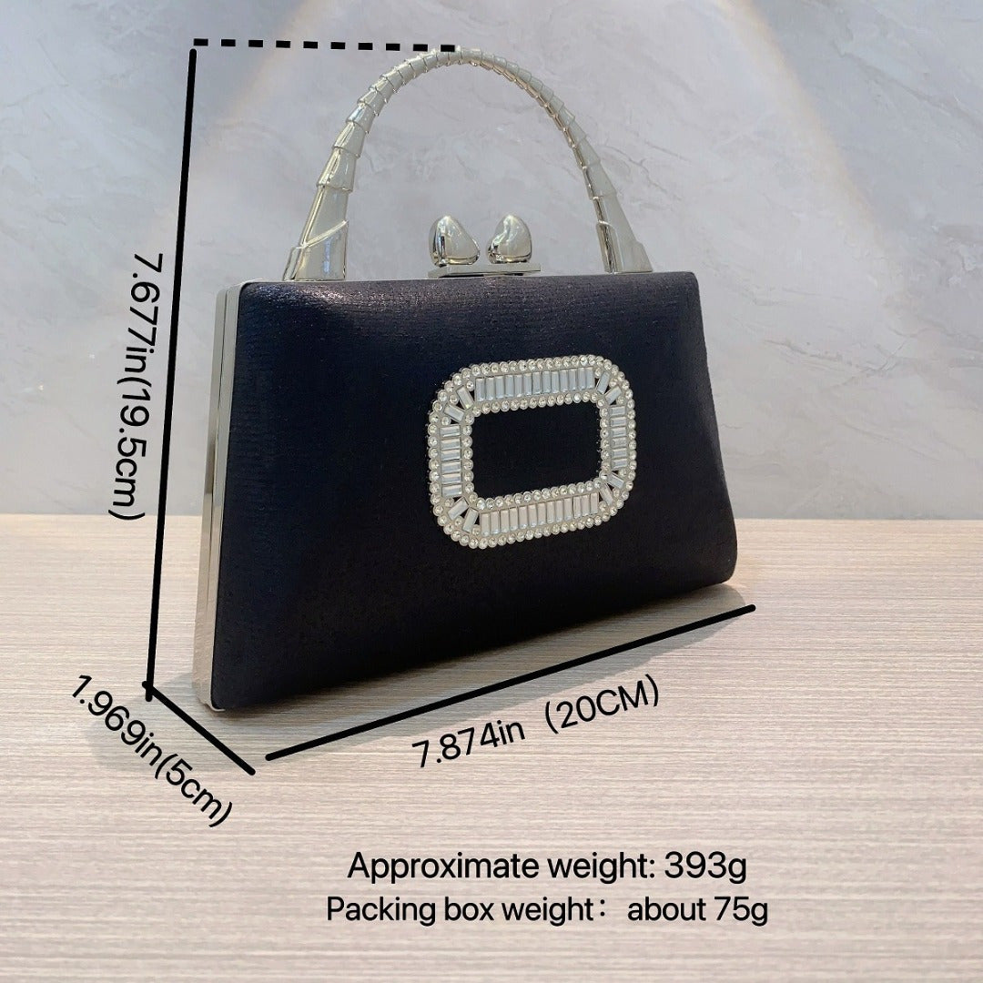 Elegant gold and silver clutch purse with diamond clasps, featuring a crossbody strap, perfect for evening events.