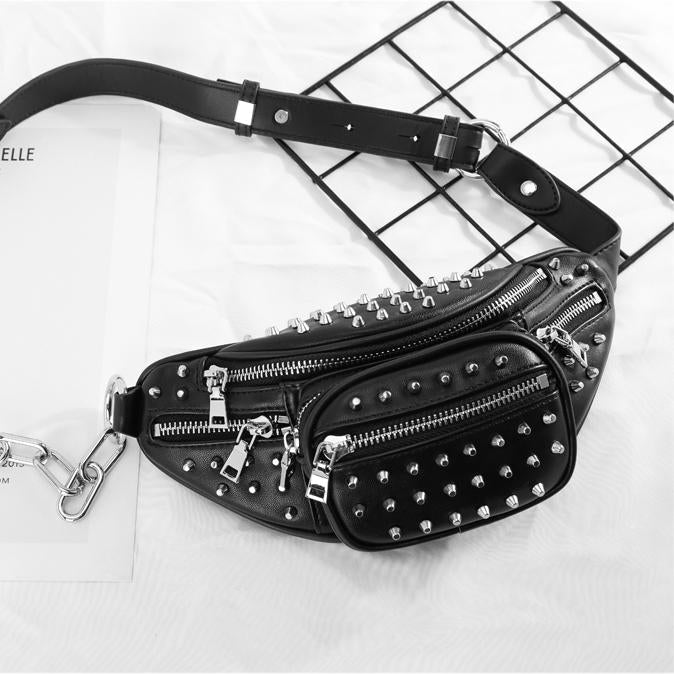 Moto Rivets Fanny Crossbody Bag in black studded vegan leather with adjustable chain strap and multiple zipper pockets.