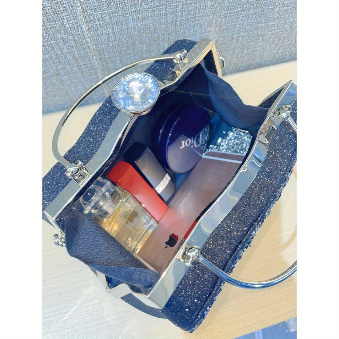Elegant nightout bag with diamond inlaid design, featuring metallic handles and a shiny finish, perfect for formal events.