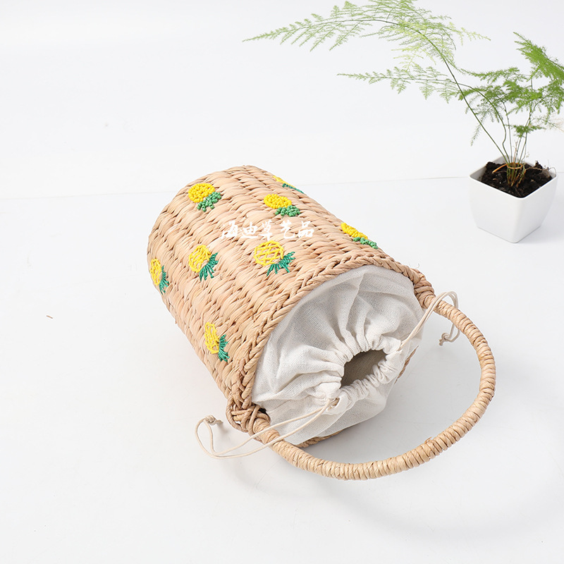 Woven basket with pineapple design.