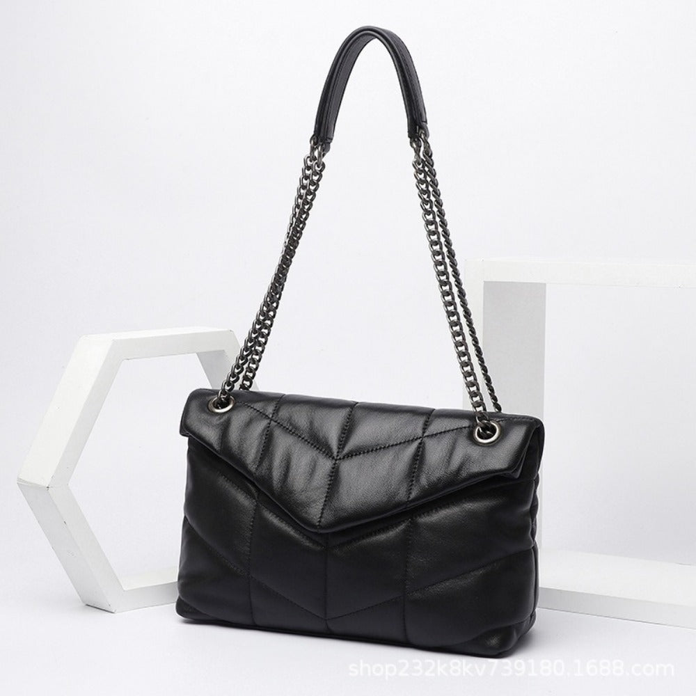 Stylish Puffer Shoulder Bag with chain strap and quilted design, perfect for women. Spacious and trendy crossbody purse.