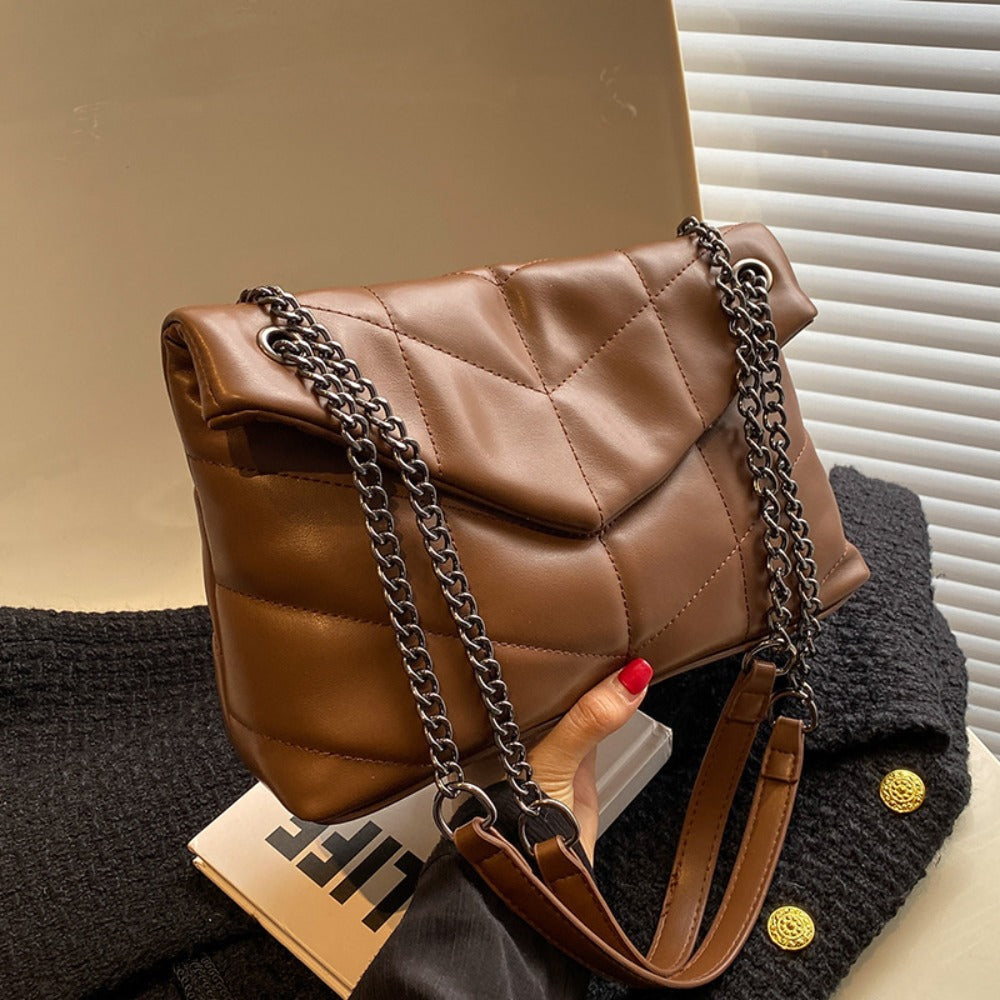 Stylish Puffer Shoulder Bag with chain strap and quilted design, perfect for women. Spacious and trendy crossbody purse.