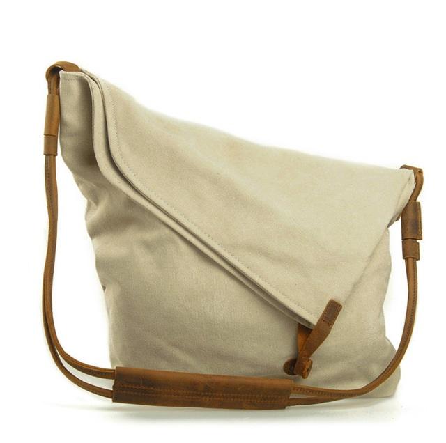 A stylish Retro Art Cloth Crossbody Bag for Women featuring a unique design, high-density canvas material, and adjustable cowhide shoulder strap.