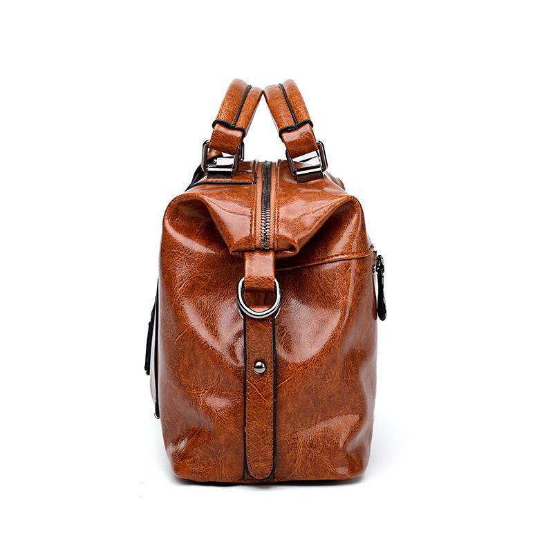 A stylish Retro High Quality Oil-wax Leather Lady's Messenger Bag showcasing its elegant design and compartments.