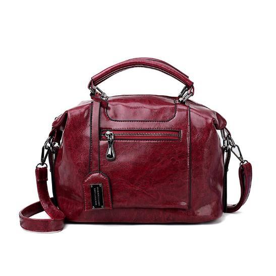 A stylish Retro High Quality Oil-wax Leather Lady's Messenger Bag showcasing its elegant design and compartments.