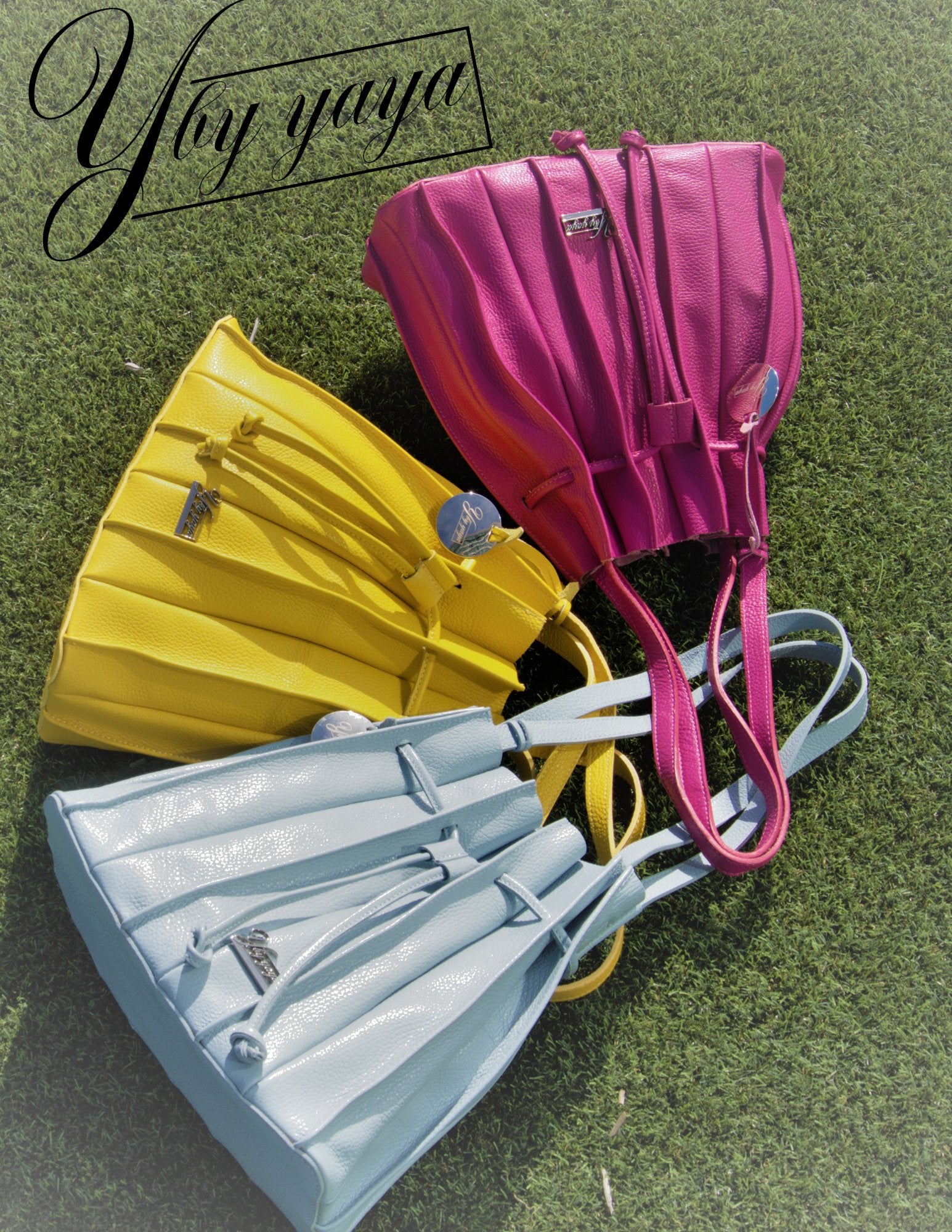 Signature YBY Bella Bag in Pebble Leather with pleats and detachable strap, showcasing its elegant design and Italian craftsmanship.