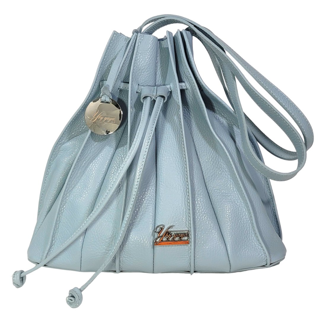 Signature YBY Bella Bag in Pebble Leather with pleats and detachable strap, showcasing its elegant design and Italian craftsmanship.