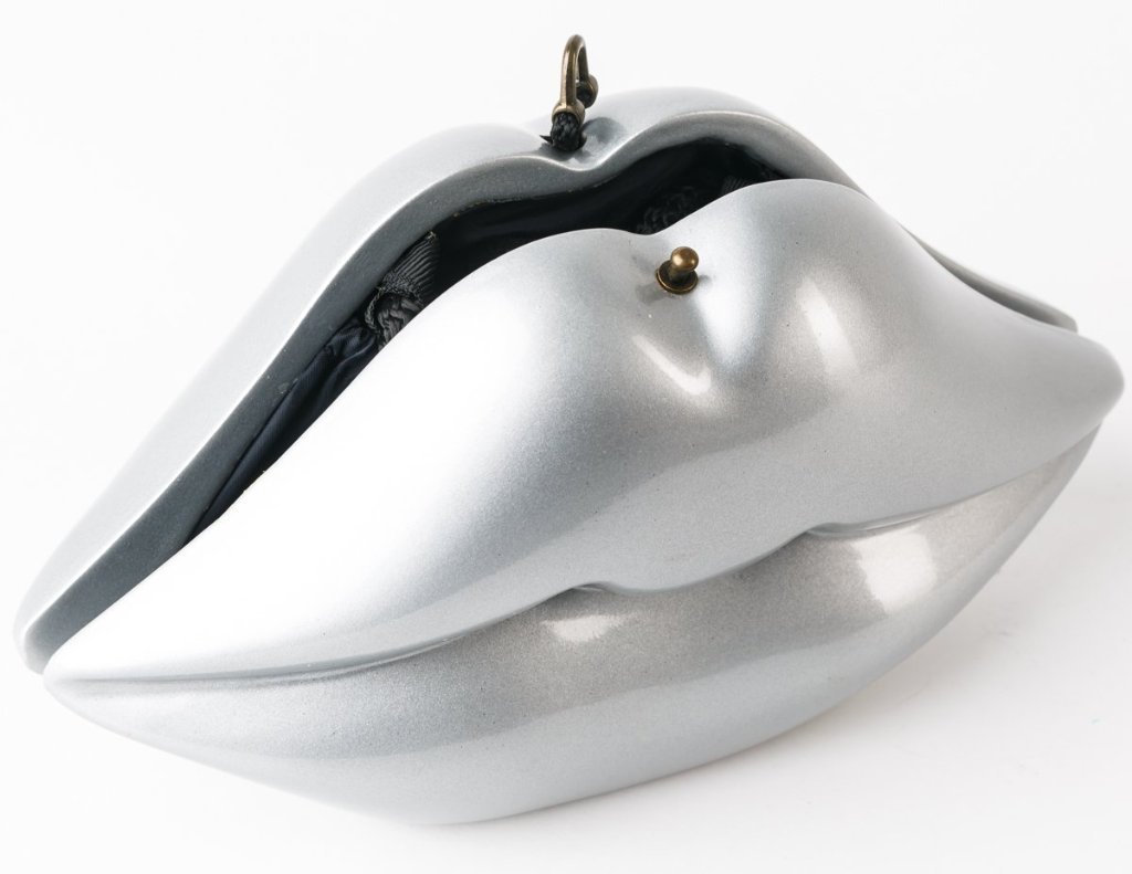 Handmade Silver Lips sculpture featuring a black lacquer body and vibrant red hand-painted lips, showcasing 60's fashion inspiration.