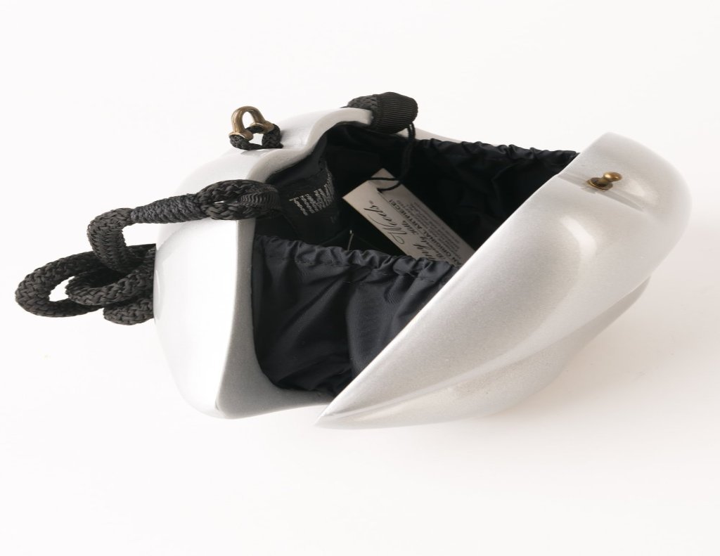 Handmade Silver Lips sculpture featuring a black lacquer body and vibrant red hand-painted lips, showcasing 60's fashion inspiration.