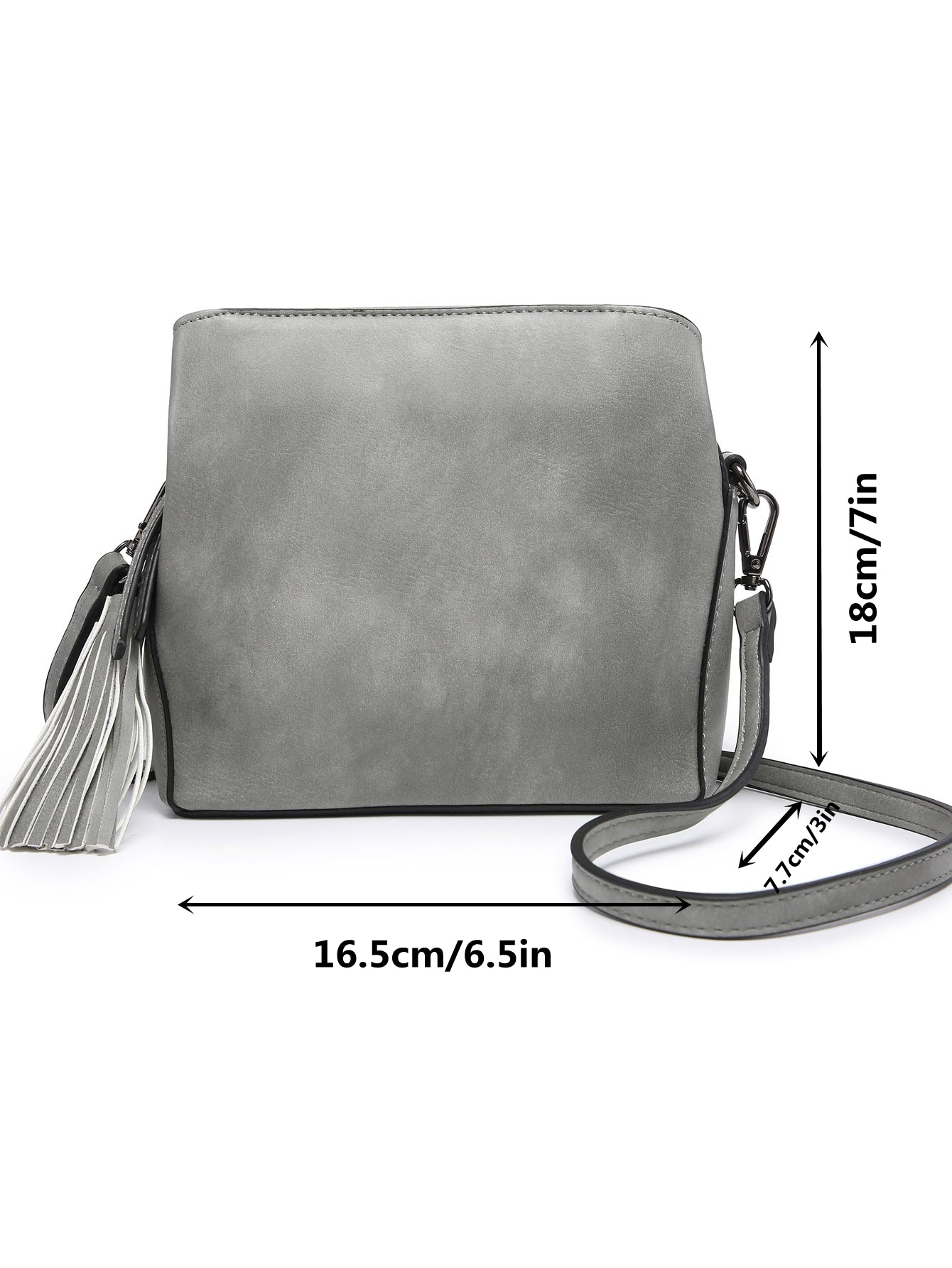 Small crossbody bag in vegan leather with triple compartments and pewter fitting, showcasing its stylish design and practicality.