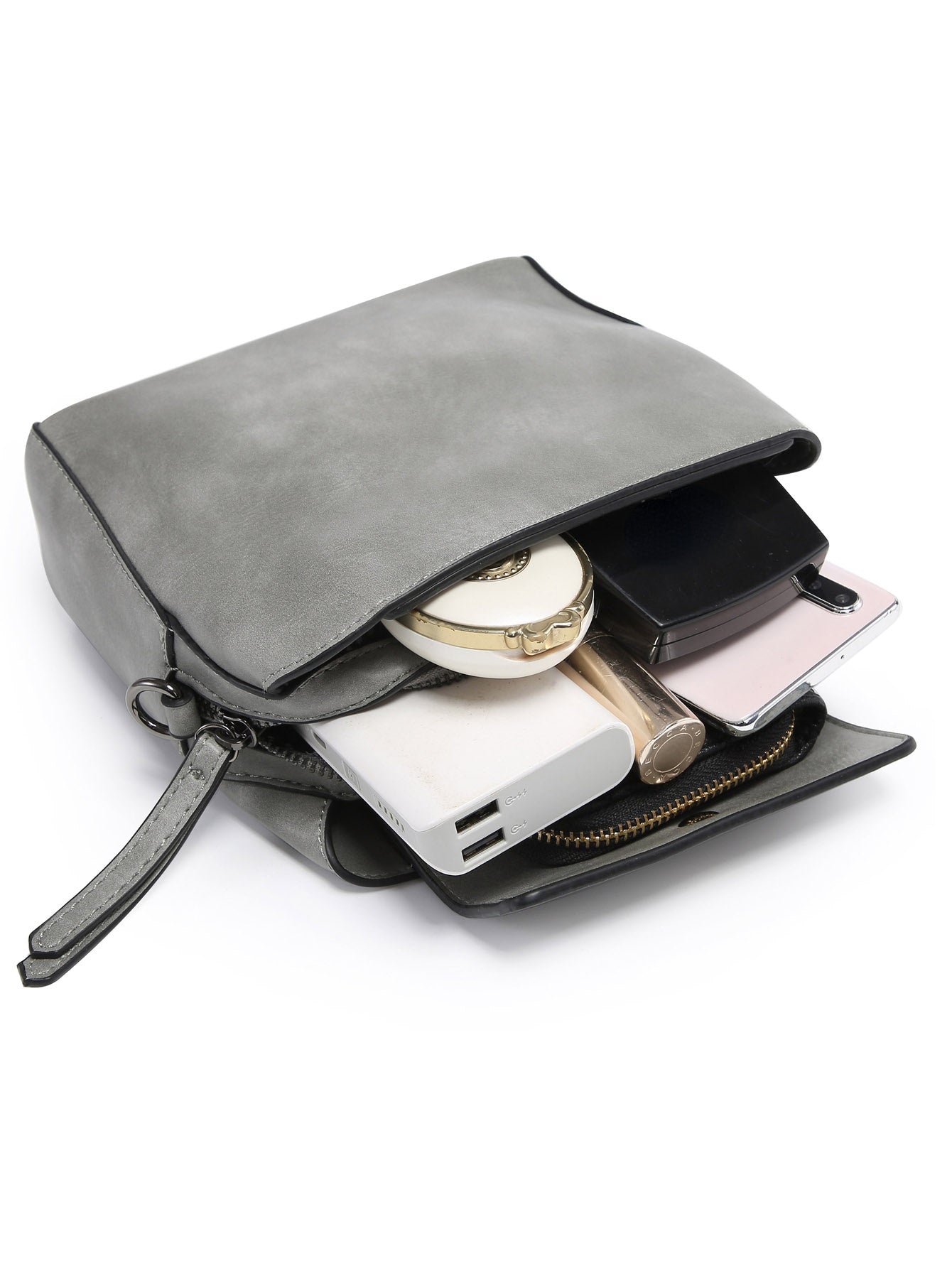 Small crossbody bag in vegan leather with triple compartments and pewter fitting, showcasing its stylish design and practicality.