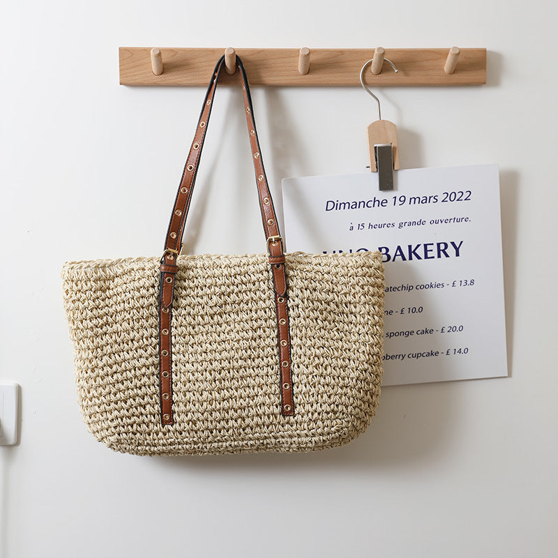 TerraWeave™ Tote in natural woven straw, showcasing a khaki color and spacious design, perfect for stylish outings.