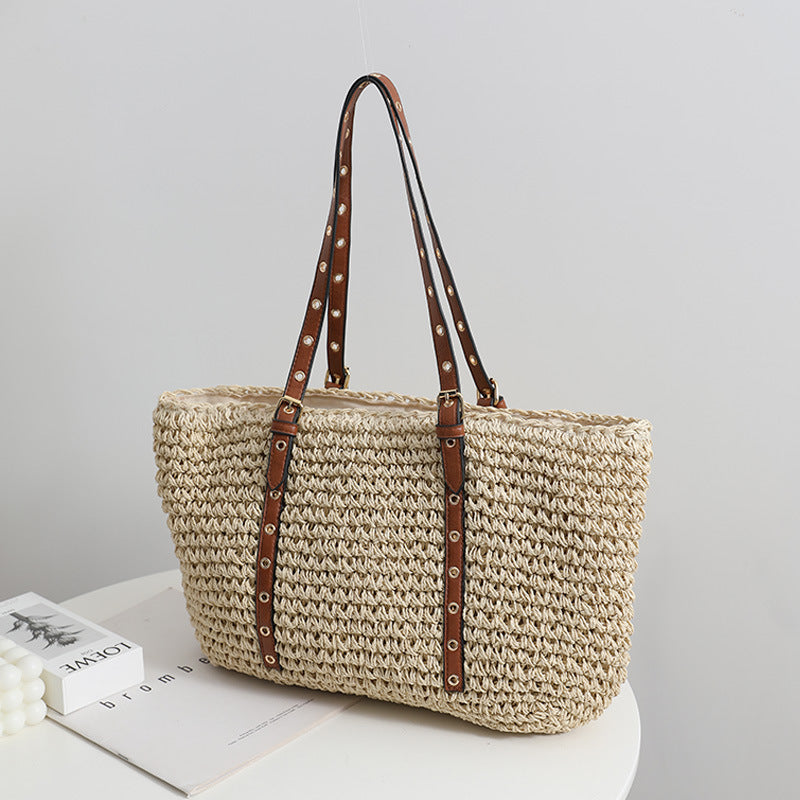 TerraWeave™ Tote in natural woven straw, showcasing a khaki color and spacious design, perfect for stylish outings.