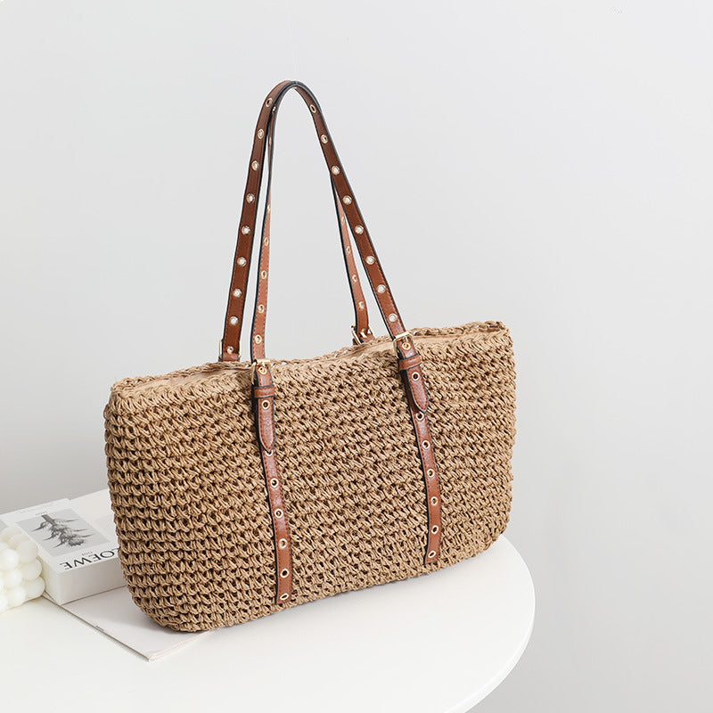 TerraWeave™ Tote in natural woven straw, showcasing a khaki color and spacious design, perfect for stylish outings.