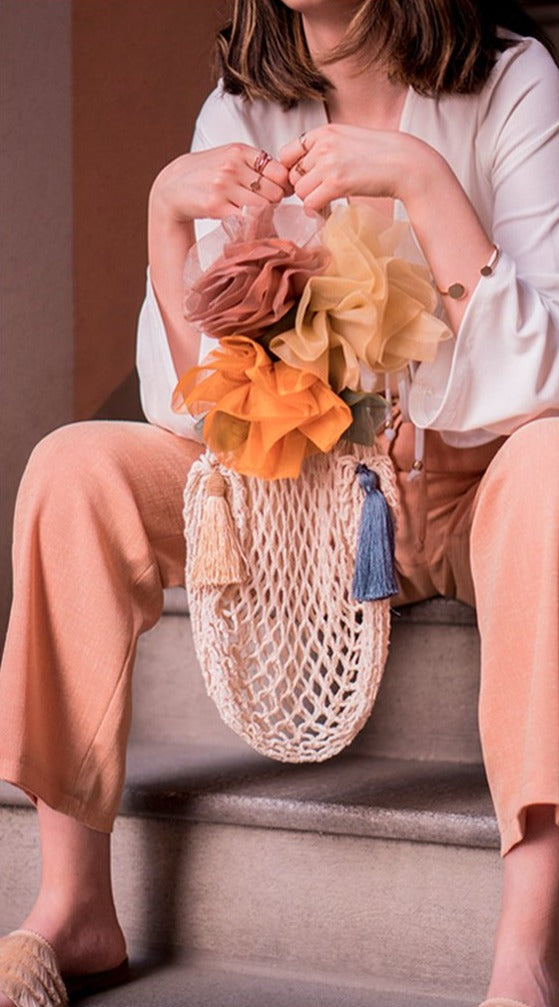 THALIA handmade cotton net bag in natural cream color with chiffon roses and tassels.