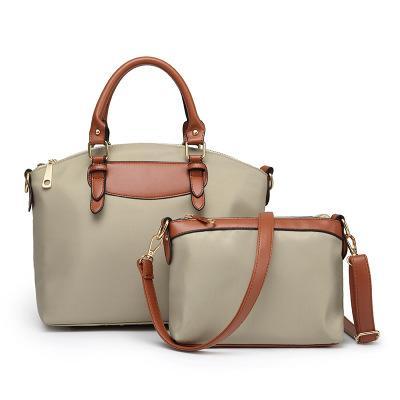 Two-piece set of stylish nylon cloth handbags for women, featuring a large and small bag in a modern design.