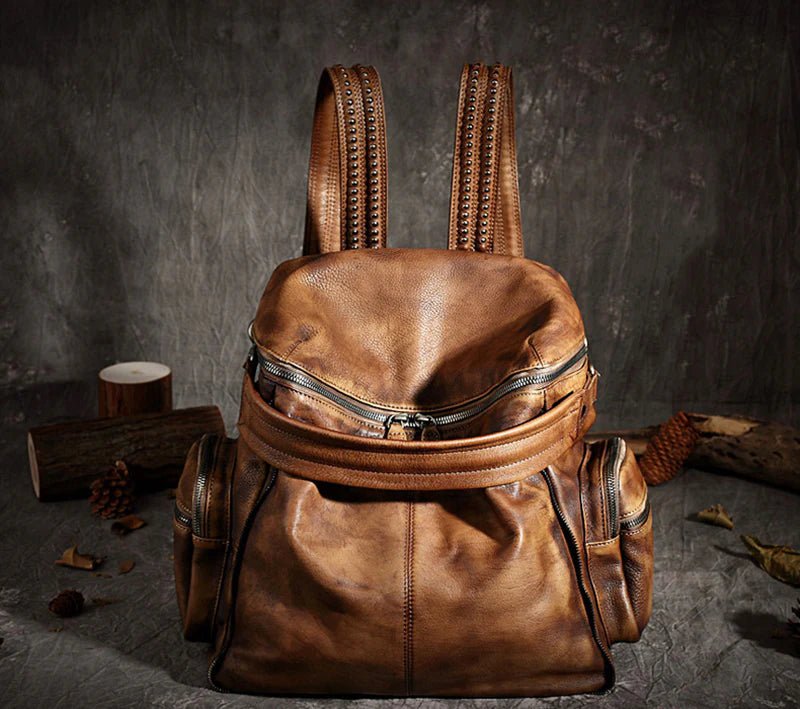 A stylish unisex leather backpack made from full grain leather, featuring multiple pockets and an adjustable shoulder strap, ideal for everyday use.