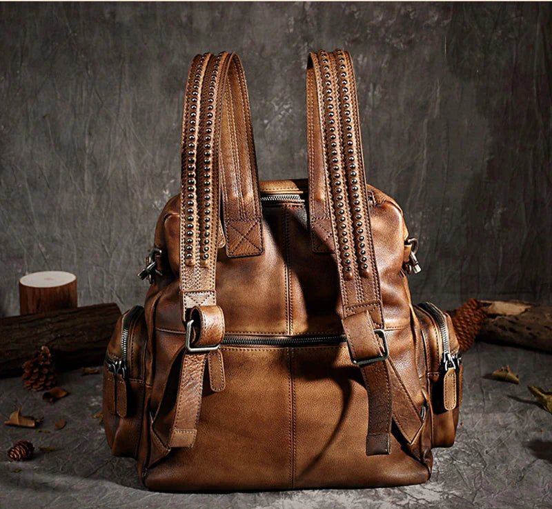 A stylish unisex leather backpack made from full grain leather, featuring multiple pockets and an adjustable shoulder strap, ideal for everyday use.