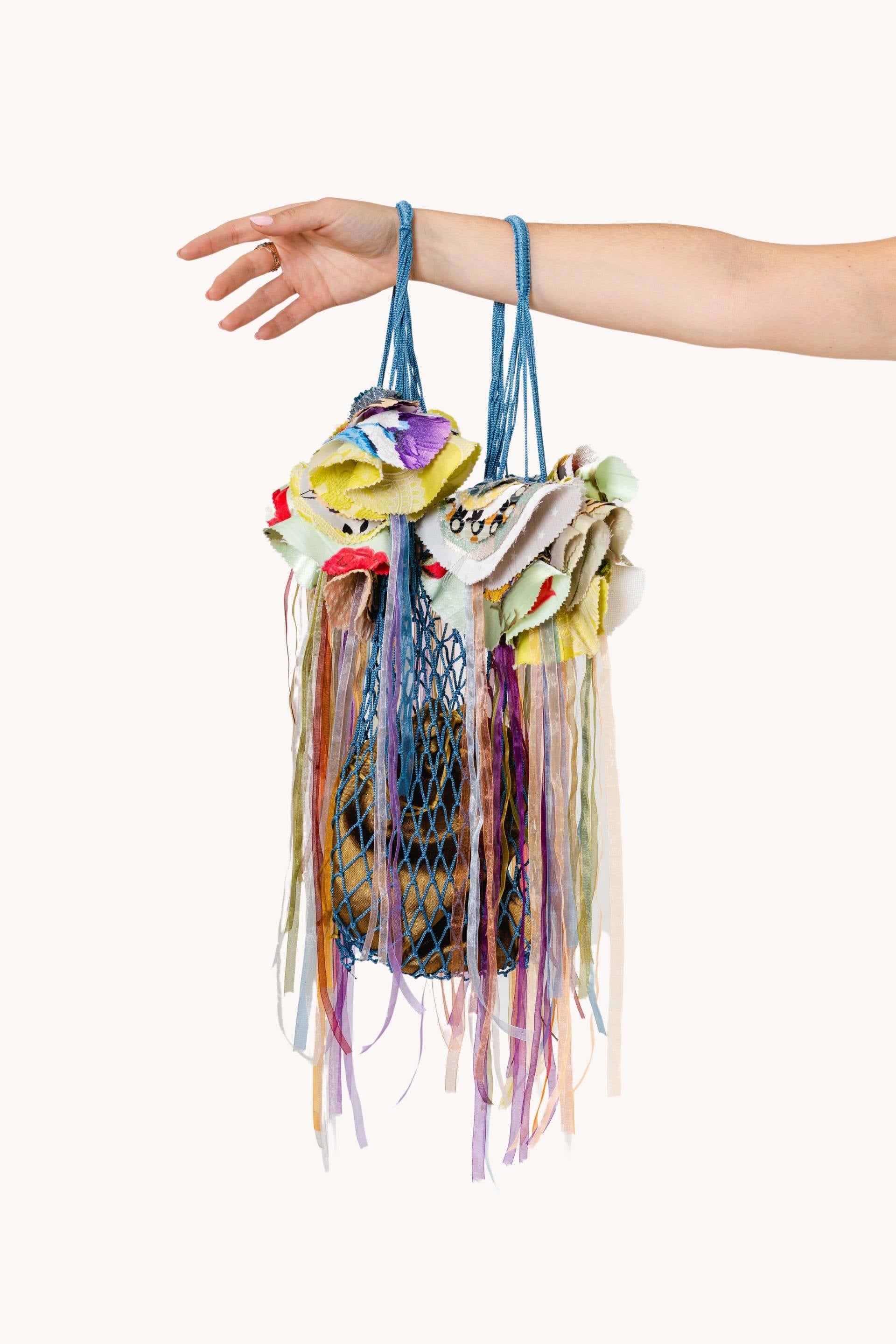 A stunning White-spotted Jellyfish showcasing its semi-transparent bell adorned with white polka dots, gracefully floating in clear blue water.