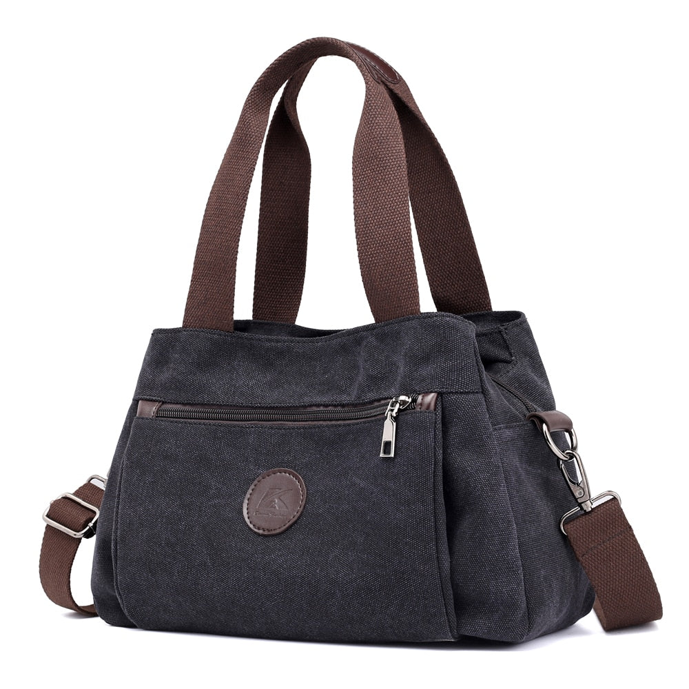 Women's Canvas Shoulder Messenger Bag in solid color, featuring multiple pockets and a zipper closure, perfect for everyday use.