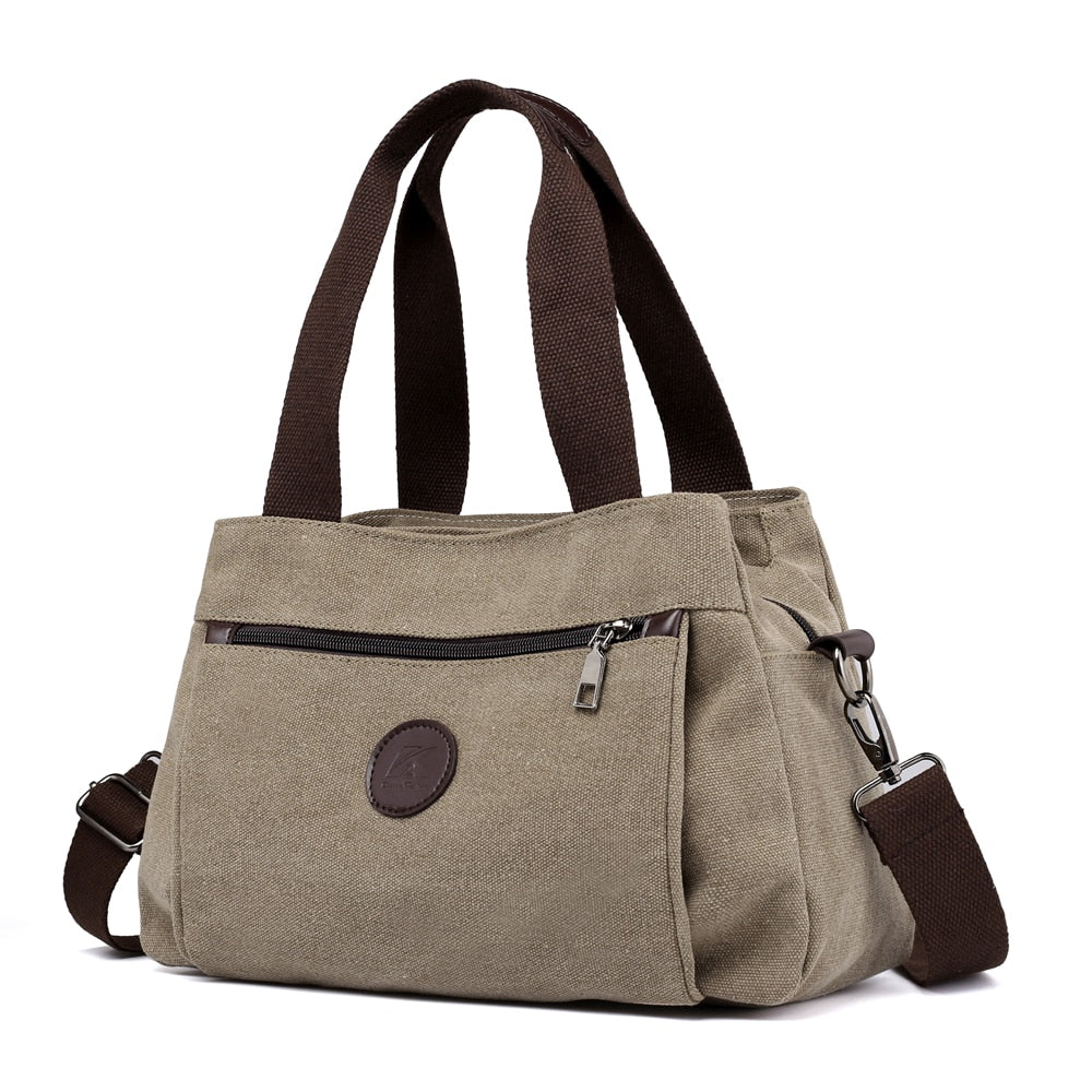 Women's Canvas Shoulder Messenger Bag in solid color, featuring multiple pockets and a zipper closure, perfect for everyday use.