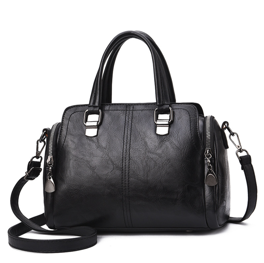 A stylish Women's High Quality Casual Messenger Bag made of soft PU fabric, featuring a Boston bag design with multiple internal pockets and a zipper closure.