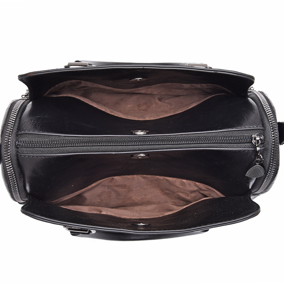 A stylish Women's High Quality Casual Messenger Bag made of soft PU fabric, featuring a Boston bag design with multiple internal pockets and a zipper closure.