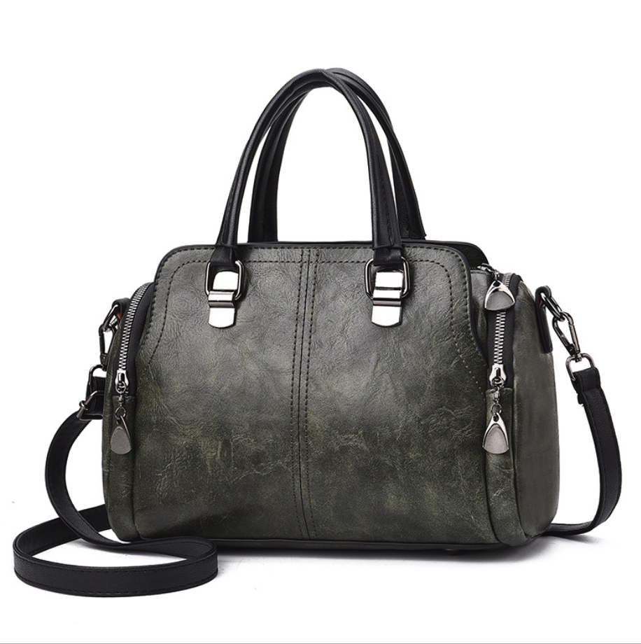 A stylish Women's High Quality Casual Messenger Bag made of soft PU fabric, featuring a Boston bag design with multiple internal pockets and a zipper closure.