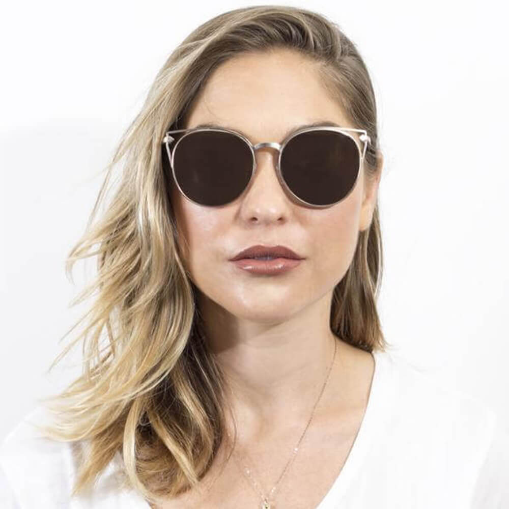 Clayton Women Round Petite Cat Eye Sunglasses with vintage round lenses and cut-out design, perfect for stylish summer outfits.