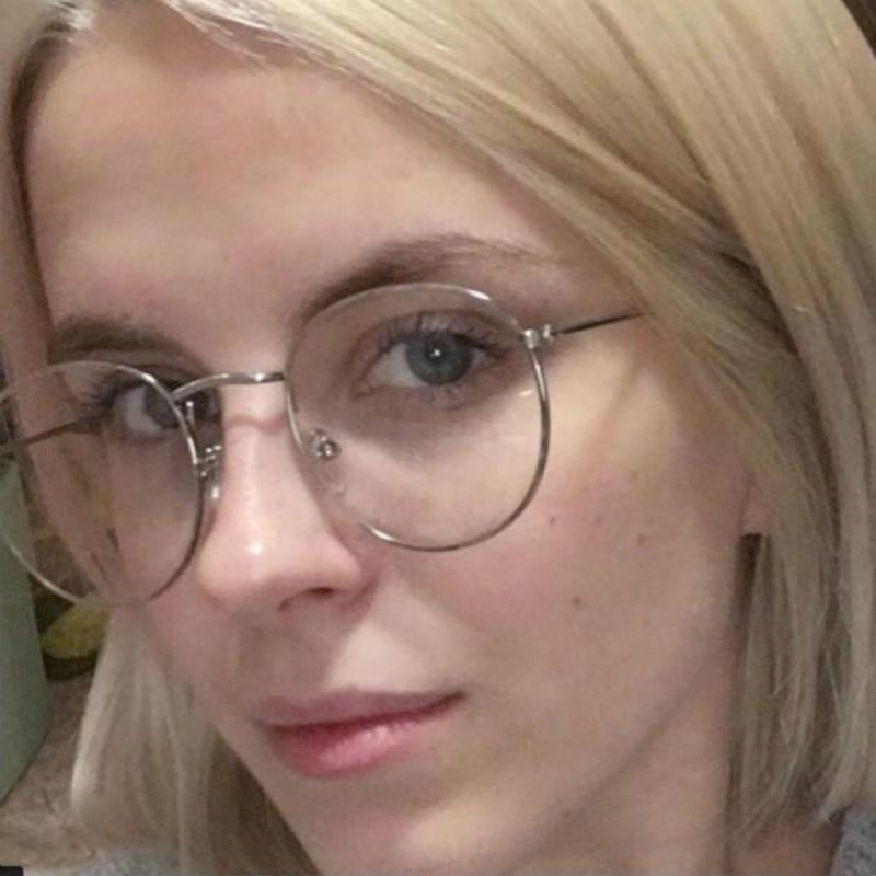 Stylish EP New Designer Woman Glasses with metal round frames, showcasing their elegant design and comfortable fit.