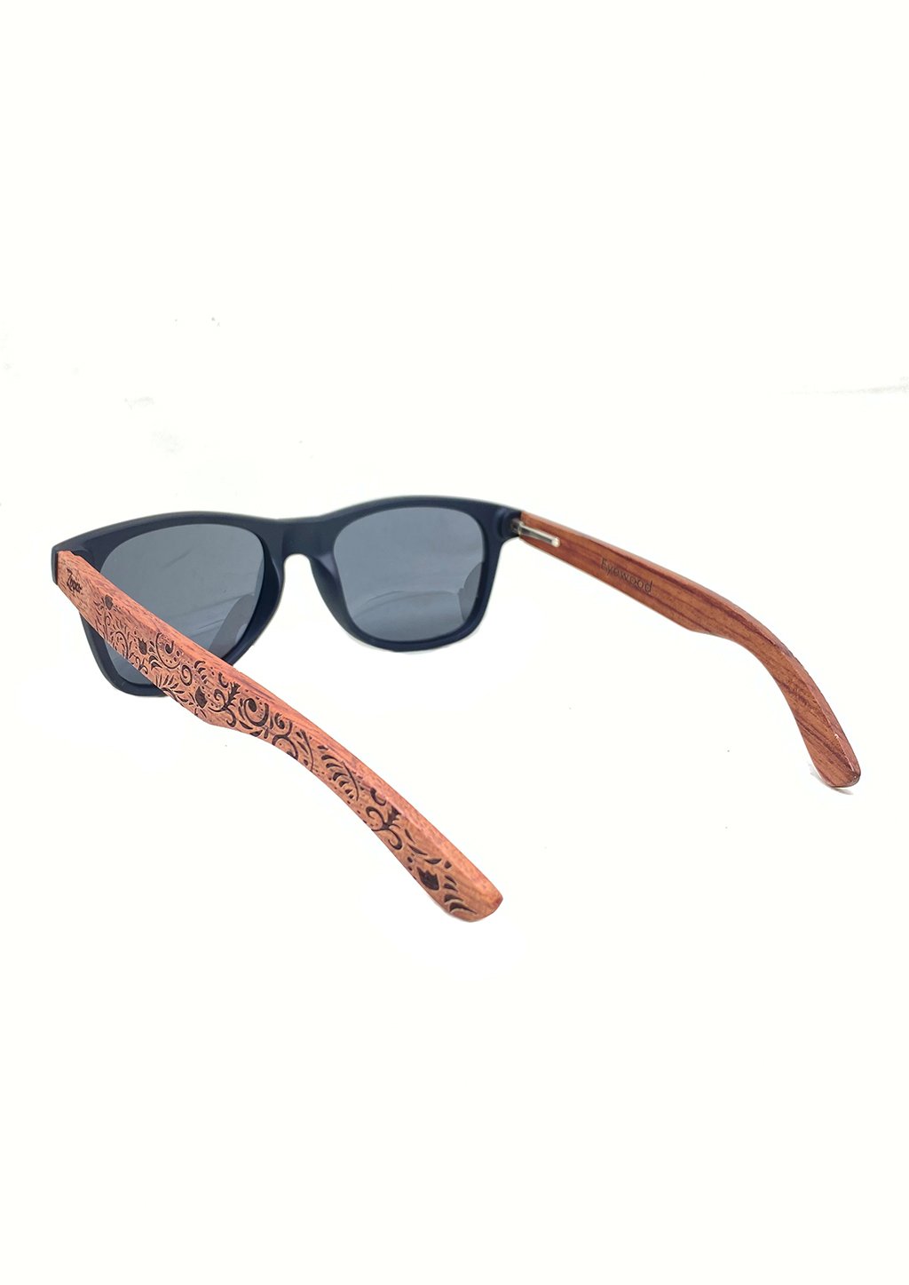 Eyewood engraved wooden sunglasses made from rosewood with a flower pattern, showcasing polarized black lenses and stainless steel hinges.