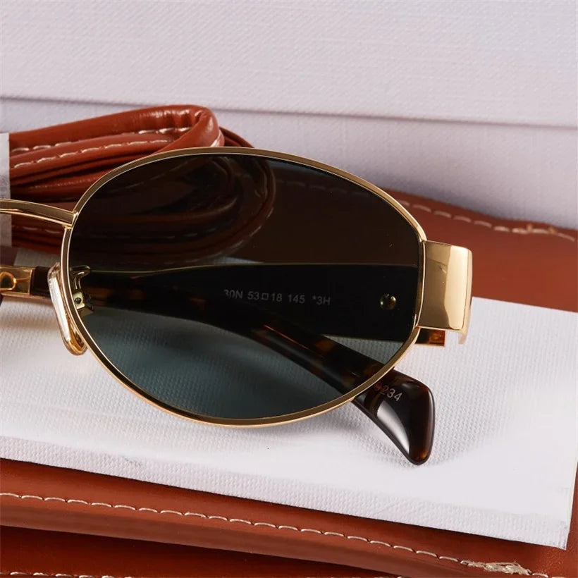 Gold Metal Frame Oval Small Sunglasses from Sexikinis Swim, featuring a sleek alloy frame and UV400 lenses, perfect for stylish summer outings.