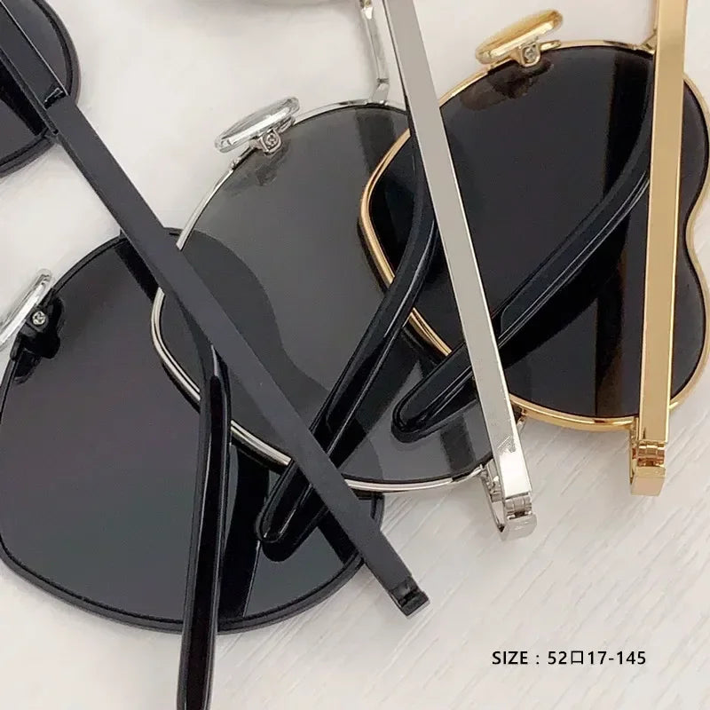 Heart a luv sunglasses by Sexikinis Swim featuring stylish acetate frames and photochromic lenses for UV protection.