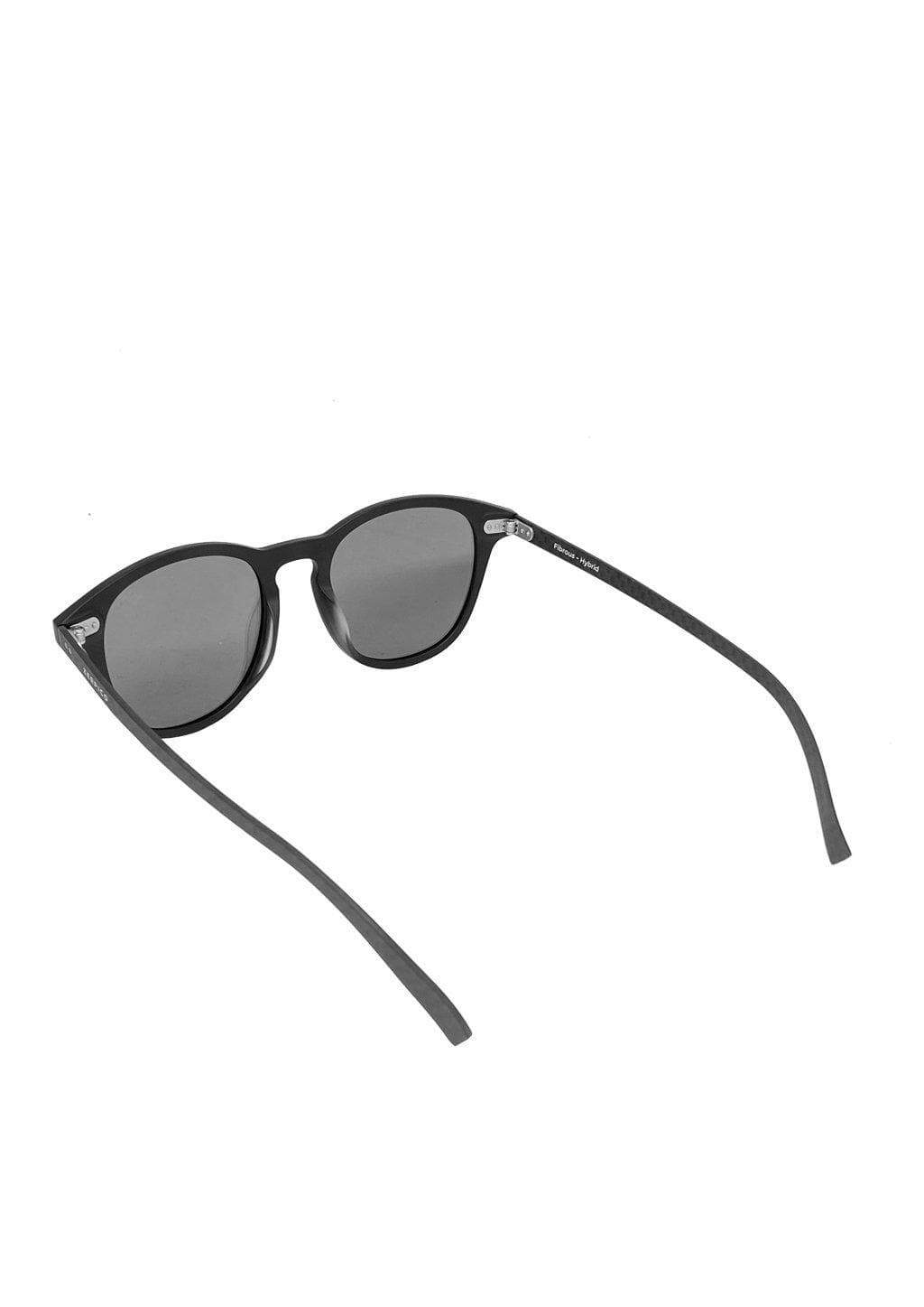 Hybrid Halo sunglasses featuring a round design with carbon fiber and acetate materials, showcasing various lens colors.