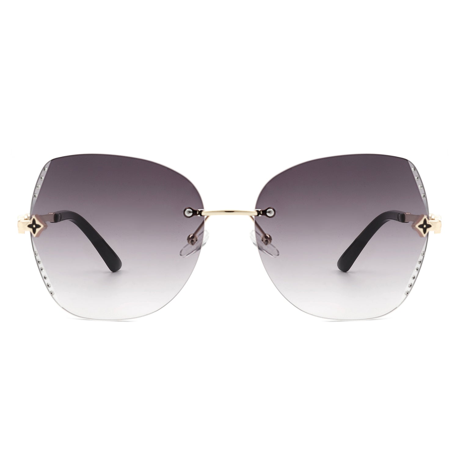 Kineticx Oversize Rimless Butterfly Sunglasses with tinted lenses and rhinestone accents, showcasing a stylish and glamorous design.